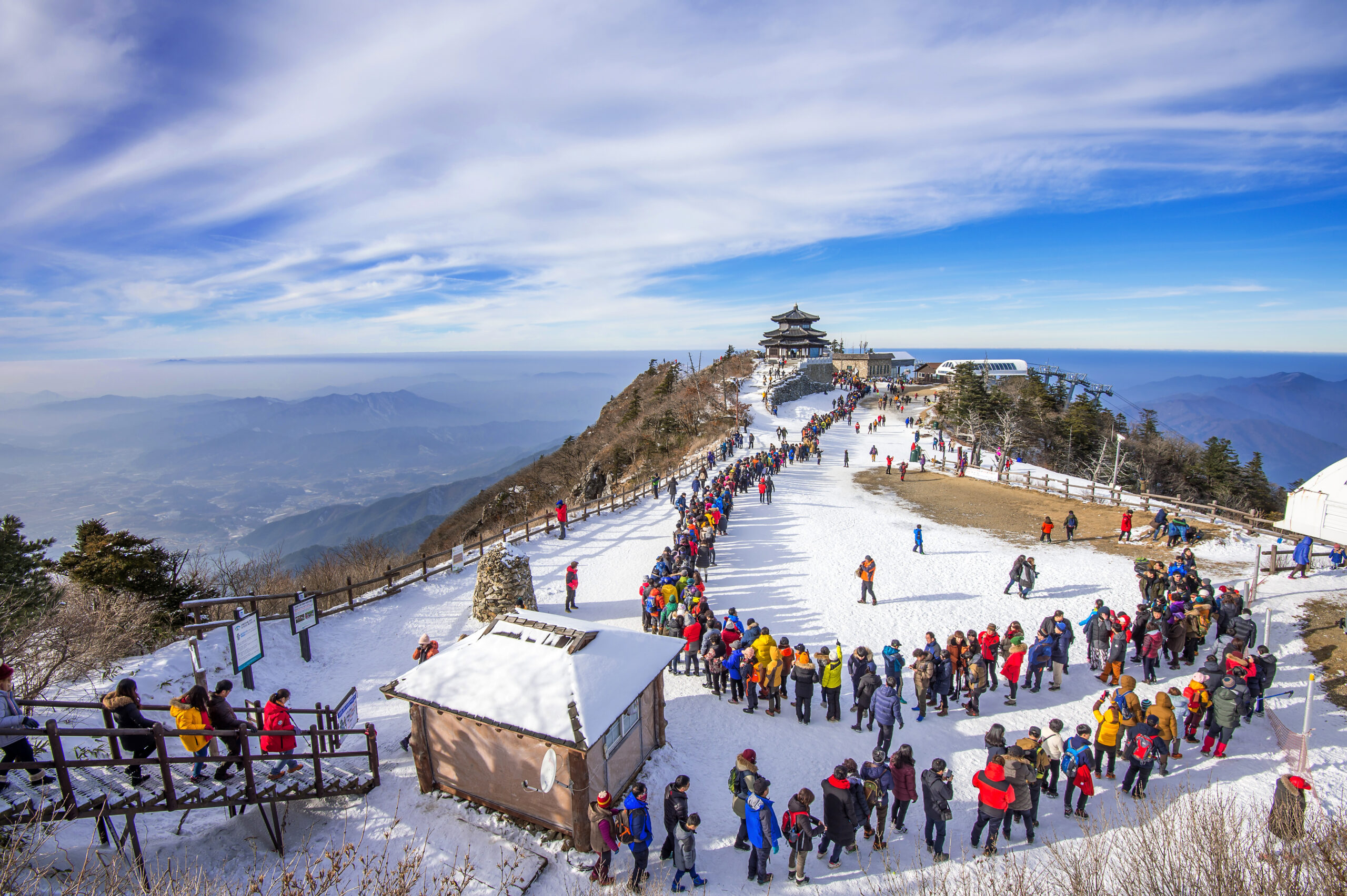 DEOGYUSAN,KOREA - JANUARY 1: Tourists taking photos of the beautiful scenery and skiing around Deogyusan,South Korea on January 1, 2016.